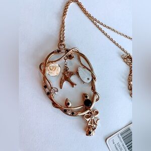 Golden Bird and flowers pendant necklace